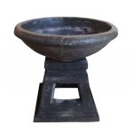 A photo of a stone ripple bird bath.