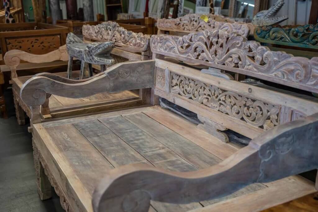 wooden daybed with carvings