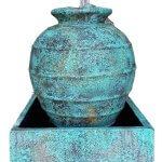 Turquoise round small vase water feature with square base.